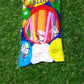 Child happily using a blue balloon pump to inflate a long twisting balloon.