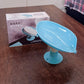Self draining soap dish in active use, keeping soap dry.