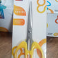 Sharp stainless steel scissors blades and ergonomic handle for comfortable, precise cuts.