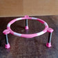 Single ring matka stand made of high-quality stainless steel on a wooden surface.