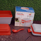 Empty sturdy lunch box with a clear lid, showcasing its airtight seal and handle.