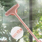 A person holding the blue and grey 2-in-1 Mesh Cleaning Brush, ready to clean a window.