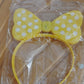 LED polka dot bow hairband displayed upright for kids' use