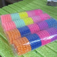 Various telephone wire hair bands in different colors arranged together.