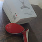 Compact electric face massager with its charging cable