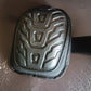 Heavy-duty knee pad displayed upright showcasing its protective shell and padding
