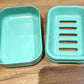 Stacked aqua green soap cases ideal for travel and home bathrooms