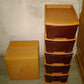 Full view of the brown 5-tier plastic modular drawer system against a plain background.