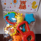 Overhead view displaying all five baby rattle toys in the set