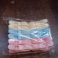 Colorful plastic cloth clips arranged neatly in rows for easy selection