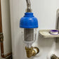 Shower filter in use, purifying bathroom water