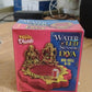 Close-up shot of golden LED pooja diya activated by water sensor