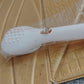 Person styling hair with self-cleaning anti-static detangling massage hairbrush