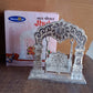 Handcrafted silver Bal Gopal Jhula swing displayed indoors for devotional use