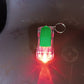 Person holding Mini Car LED Keychain Light to show compact size