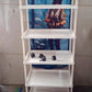 Foldable baby wardrobe with colorful cartoon print showing hut shaped design