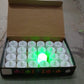 Smokeless green tealights emitting a warm, inviting glow.