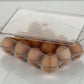 Stackable egg storage box with 12 compartments, shown empty.