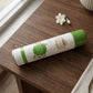 User spraying premium air freshener into indoor room for freshness