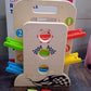 Portable Wooden Ramp Racer playset showing the convenient carry handle and cars.