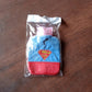 Comfortable hot water bag with a soft textile cover for gentle warmth.