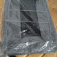 Foldable cloth storage organizer bag placed beside wardrobe