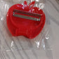 Retail packaging for the apple shaped folding vegetable peeler.