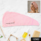 Lightweight microfiber towel wrap securing hair with button closure
