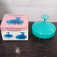 Packaging of the Calm & Curl scalp massager brush, highlighting key features.