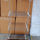Lifestyle image of the cloth drying stand in a bright, airy laundry space.