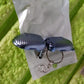 Lifestyle shot of the keychain nail clipper in a travel setting.