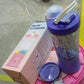 Portable smoothie maker powered on, with its blades visible and ready for use.