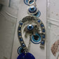 Evil eye charm wind chime with horseshoe design for home and car decor