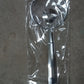 Frying filter spoon with clip used in a modern kitchen setting.