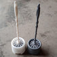 Side profile of the Pro Clean toilet cleaning brush and its compact potted holder.