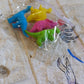 A complete set of four non-toxic dinosaur erasers, essential fun stationery for kids.