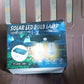Solar LED lamp packaging with product details.