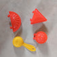 Packaging of the 4-piece red plastic dough press set for kitchen use.