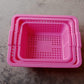 Plastic baskets for fruit, displayed neatly in a kitchen setting.
