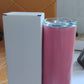 Multiple stainless steel travel mugs displayed for gifting option