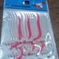 White dental floss picks with a textured grip.