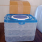 Portable egg storage box with a handle, ideal for safe transport of eggs.