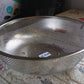 Angled shot of the versatile kitchen colander, ready for use.
