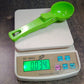 Stylish green plastic ice cream scoop for easy storage.