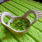 Side view of the compact stainless steel apple slicer, highlighting its efficient design.