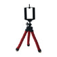 White mini tripod stand on a plain background for mobile use