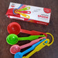 Complete 5-piece plastic measuring spoons set displayed for kitchen use.