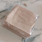 Scalloped edge tissue napkins styled for elegant table setting
