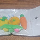 Playful display of vibrant erasers on a clean white surface.