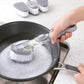 Scrubber brush with integrated soap dispenser and comfortable non-slip handle.